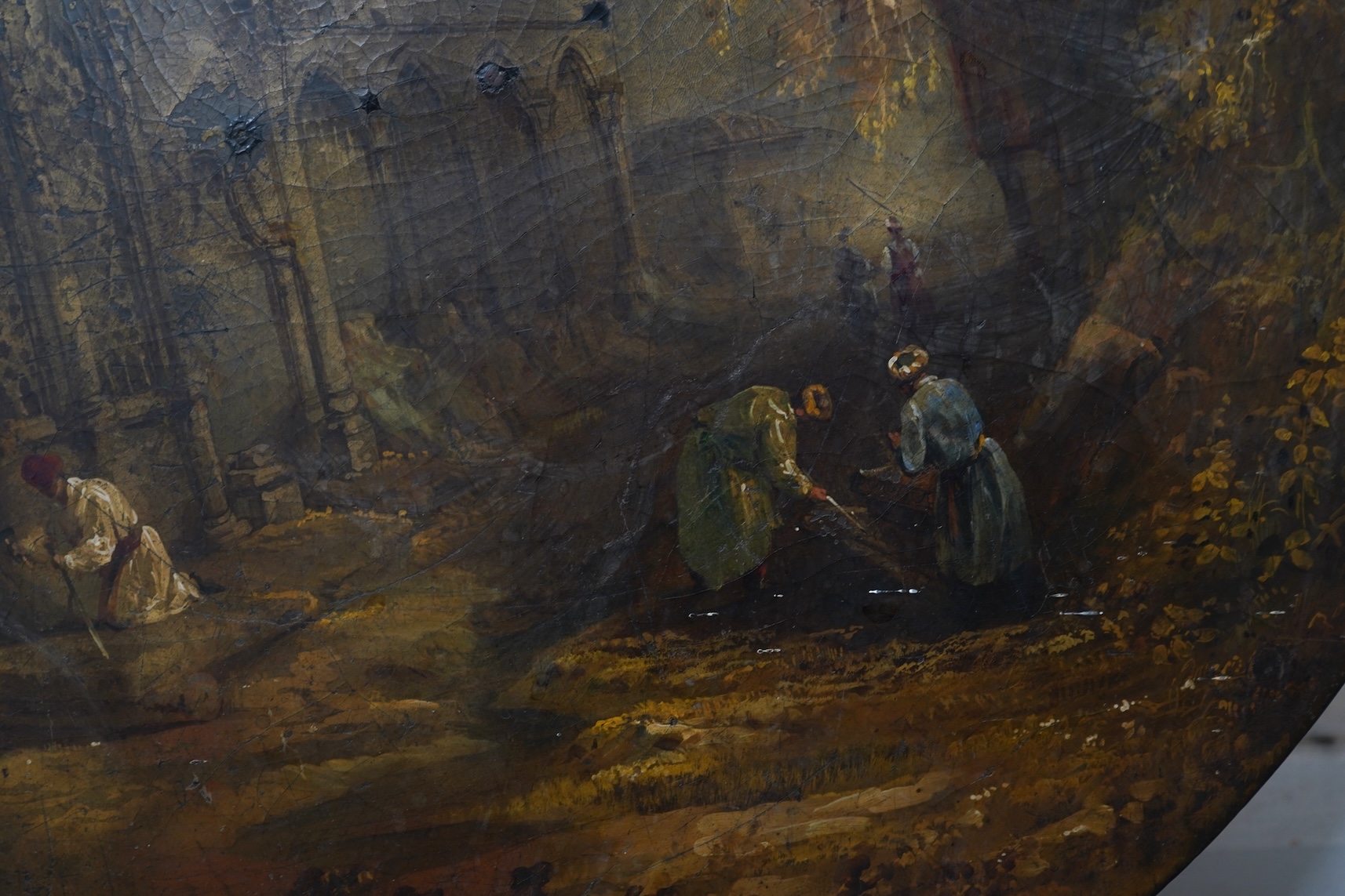 A Victorian japanned table top, depicting Indian grave robbers